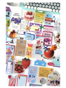 Macro shot of vintage scrapbooking stickers featuring retro gadgets and food themes