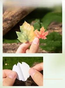 Macro detail of maple leaf stickers in various sizes with adhesive backing and autumn colors