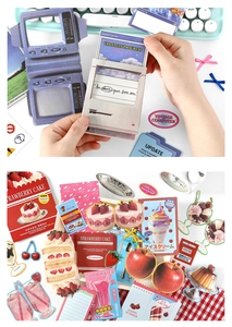 Detail of vintage Y2K computer shaped cards and colorful dessert stickers for scrapbooking