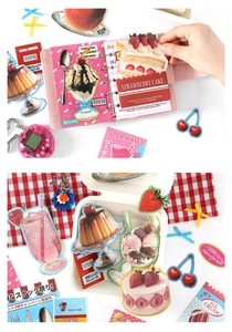 Detailed view of Y2K style dessert stickers being applied to a planner notebook
