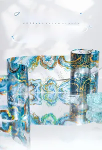 Close-up of Aurora Prism PET tape with blue marble patterns and gold foil for DIY crafts