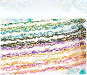 Macro detail of Auroral Prism PET decorative tape with crystal patterns and gold foil