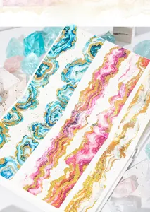 Detail of agate texture washi tape with gold foil accents for DIY journaling crafts