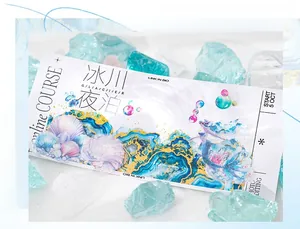 Macro detail of Glacier Night themed scrapbooking tape with elegant gold foil mermaid motifs
