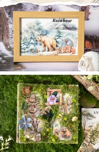 Detail of 3D animal scenery stickers with polar bear and forest themes in wooden frames