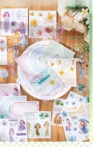 Detailed view of floral girl stickers with geometric frames on a wooden desk setup