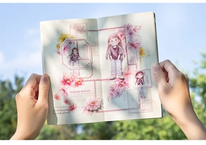 Macro shot of semi-transparent watercolor flower and girl stickers on a notebook