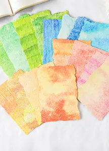 Macro view of watercolor aesthetic paper with embossed textures and scalloped edges