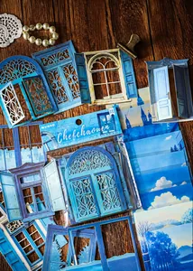 Macro shot of Chefchaouen themed vintage blue door and window paper stickers for scrapbooking