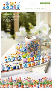 Detailed view of floral and succulent washi tape on a minimalist book and fabric setup