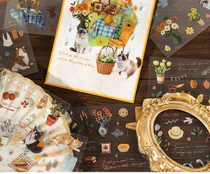 Feuilles d'autocollants rétro détaillées avec chats et fleurs sur un bureau vintage