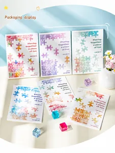Dettaglio di adesivi puzzle ad acquerello con testo 'Piecing together a piece of fun'