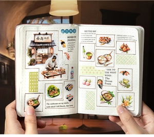Close-up of Japanese food theme stickers on a journal featuring ramen and sushi illustrations