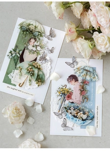Macro detail of vintage floral umbrella stickers with intricate lace edges for scrapbooking
