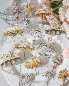 Detail of vintage floral umbrella PET stickers with delicate rose motifs and water droplets