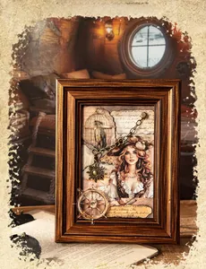 Macro detail of 3D collage nautical frame with metal steering wheel and anchor charms