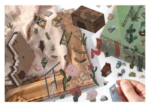 Detail of vintage PET stickers featuring cactus and desert botanicals for scrapbooking