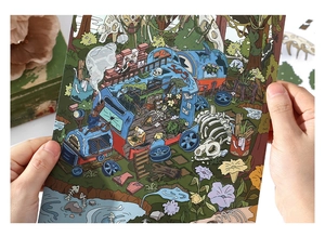 Close-up of DIY scrapbooking sticker card featuring fantasy forest and train illustration