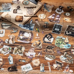 Vintage nautical PET stickers with pirates, ships, and compass designs on wood surface