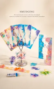 Detail of watercolor smudge stickers in soft pink and blue hues for journal DIY crafts