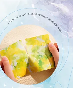 Macro shot showing the texture of watercolor washi paper being easily torn by hand