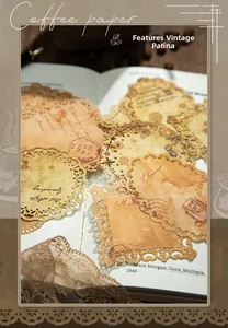 Close-up of vintage coffee-themed lace scrapbooking paper with aged textures and coffee stains