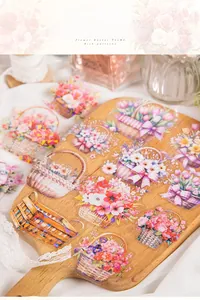 Close-up of PET flower basket stickers with tulips and roses on a wood display