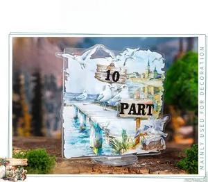 Detailed macro view of acrylic seaside travel stand with seagull and wooden pier design