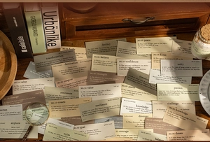 Macro detail of retro English vocabulary cards for journaling with vintage stationery props