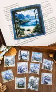 Macro view of waterproof PET stickers showing window scenery designs for DIY scrapbooking
