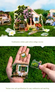 Detail of vintage PET scrapbook stickers showing semi-transparent nature scenery and architecture