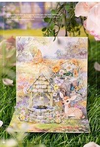 Detail of 3D pop-up decorative sticker featuring a wishing well and forest deer design