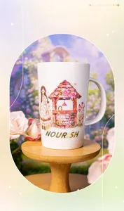 Close-up of white ceramic mug with fairy tale girl and well illustration on wood base