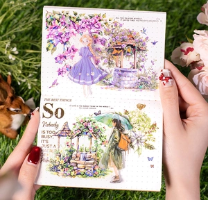 Close-up of decorative scrapbooking stickers featuring hand-drawn girl and garden elements