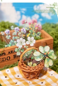 Detail of clover stickers with iridescent finish in a rustic basket for DIY scrapbooking