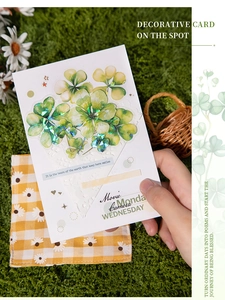 Macro view of four-leaf clover stickers with laser finish for DIY scrapbooking decor