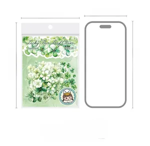 Lucky clover botanical stickers set of 10 for DIY journals shown next to phone for size