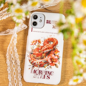 Artistic white phone case featuring a red snake and floral design on a wooden desk