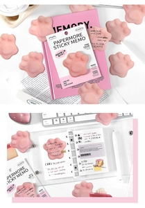 Close-up of pink cat paw pudding sticky notes in a creative bullet journal layout