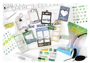Flat lay of Korean style decorative card holders and aesthetic sticker sheets on a desk