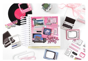 Close-up of Y2K style scrapbook set with bright pink retro tech and star graphics