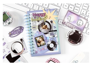 Detailed top view of Y2K style lavender spiral notebook and matching aesthetic stickers