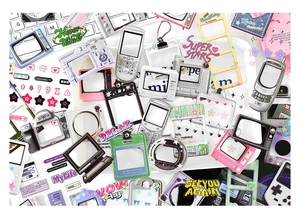 Detail of vintage Y2K electronic themed photo card holders with retro tech designs