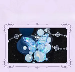 Detail of butterfly sticker with gold foil and pearlescent film showing iridescent shimmer