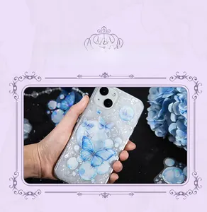 Detail of DIY semi-transparent butterfly and bubble patterns on a sleek phone case