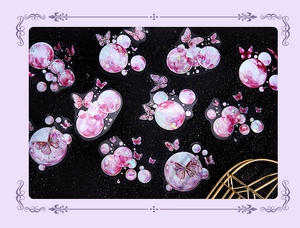 Macro shot of iridescent laser PET butterfly and bubble stickers with glossy finish