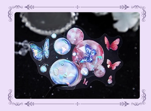 Macro shot of iridescent PET butterfly stickers with laser effect and aurora bubbles