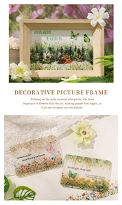 Detail of wooden picture frame with forest art and floral translucent acrylic cards