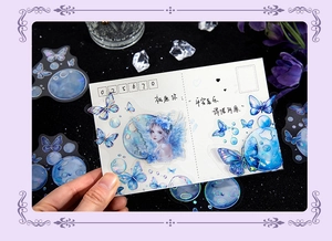 Close-up of butterfly stickers with holographic effect on decorative card