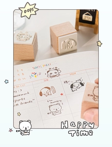 Macro detail of beech wood stamps featuring cute pandas and dogs for DIY journaling